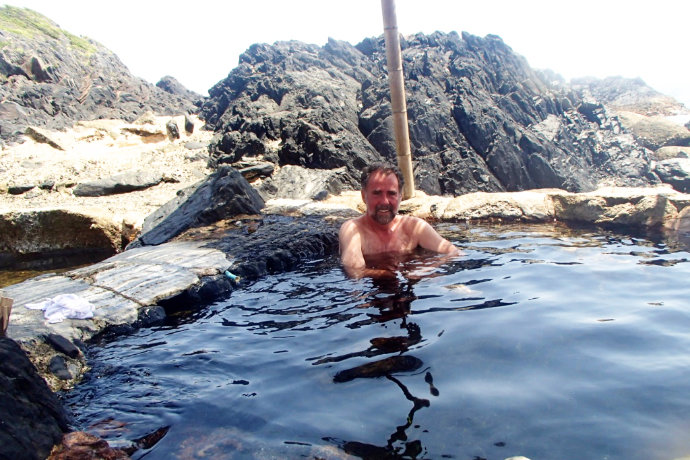 A photo of Kirk taking bath in outdoor onsen