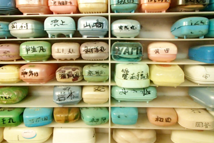 A photo of rows of soap boxes in a shelf