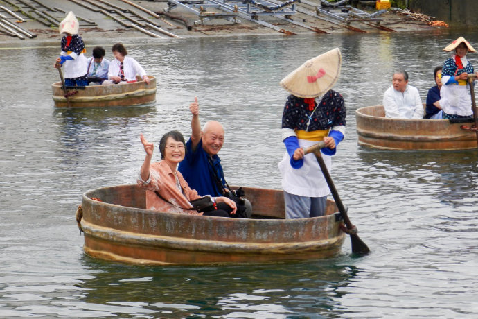 A photo of people riding a taraibune tub boat