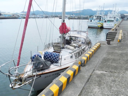 A photo of yacht mooring in a fishing port